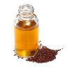 Mustard seeds with essential mustard oil on white background Mustard Oil